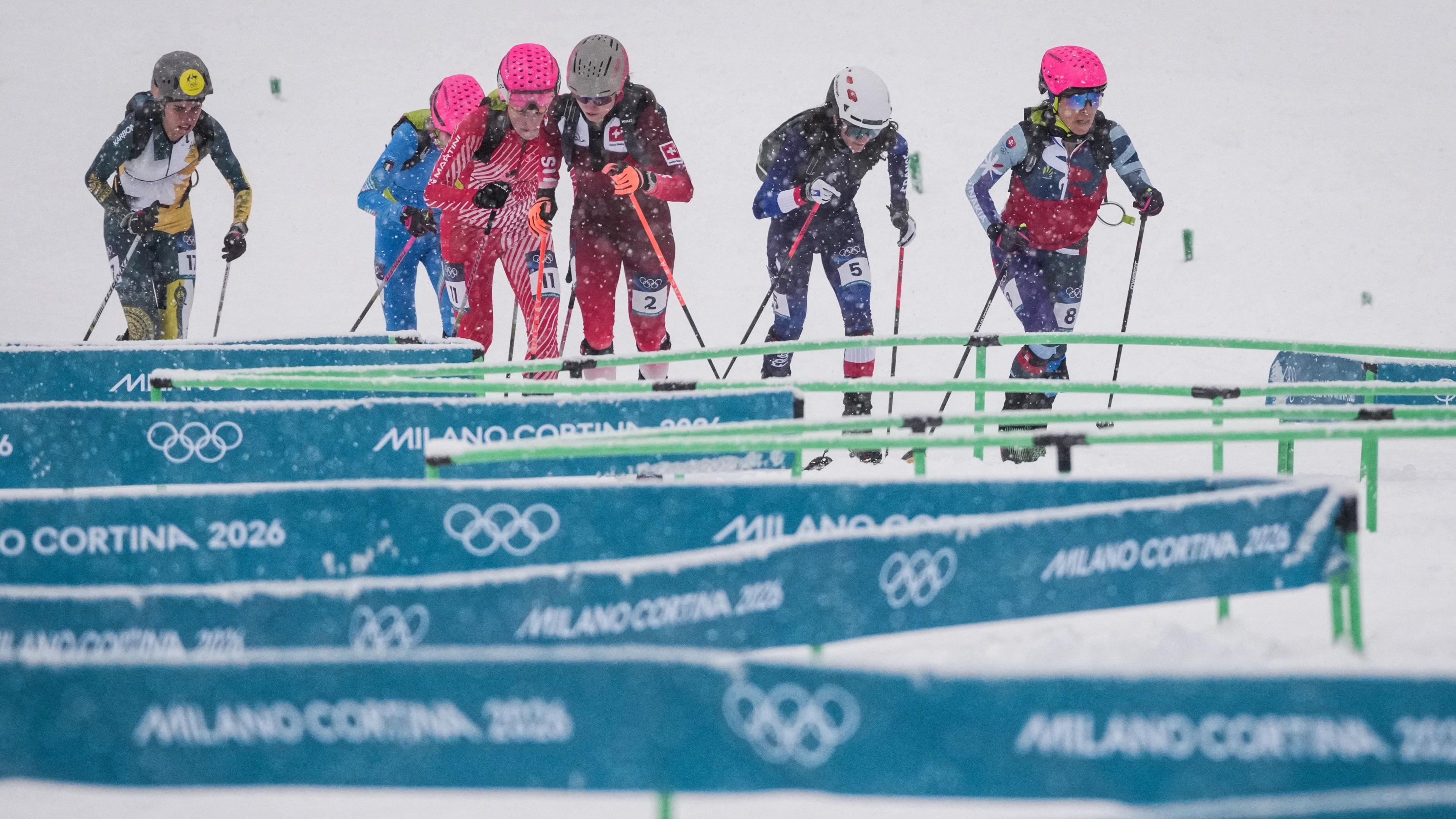 Ski mountaineering athletes navigate diamond segment of course