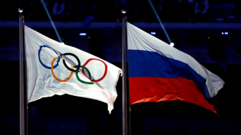 The flag of the International Olympic Committee and the flag of the Russia national flag