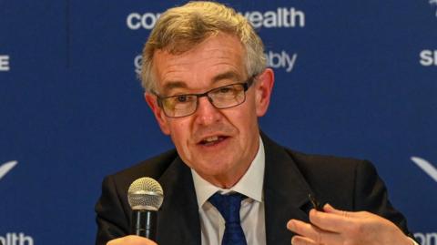 Chris Jenkins addresses a conference