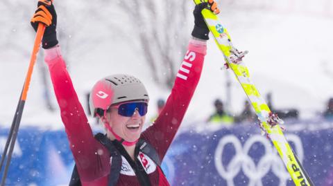 Switzerland's Marianne Fatton celebrates winning gold in skimo at Winter Olympics 2026