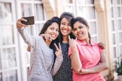 Teenage girls clicking selfie
