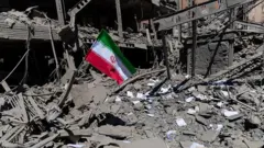 The remains of a damaged building in Tehran following an airstrike. 