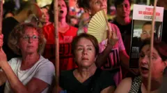 Women attend a demonstration in Tel Aviv organised by the families of the Israeli hostages in Gaza.