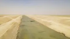 An aerial image of the canal which stretches off towards the horizon