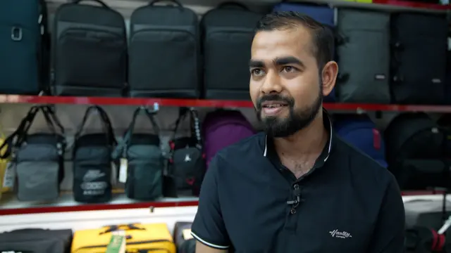 Alamim Mohammad standing in his shop
