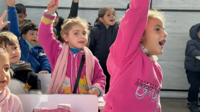 Children study in a classroom in Gaza