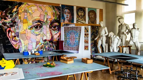 Training room with mosaics on wall at the Scuola dei Mosaicisti del Friuli (Credit: Alamy)