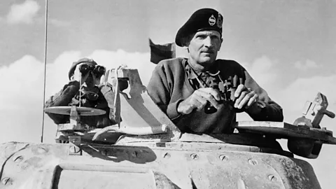 Monty wearing beret and holding binoculars in tank (Credit: Getty Images)