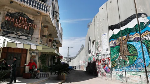 Thomas Coex/Getty Images Banksy’s The Walled Off hotel boasts that it has “the worst view in the world” (Credit: Thomas Coex/Getty Images)