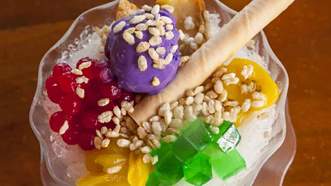 Stuart Dee/Getty Images Purple ube halaya is often used to top off a bowl of halo-halo (Credit: Stuart Dee/Getty Images)