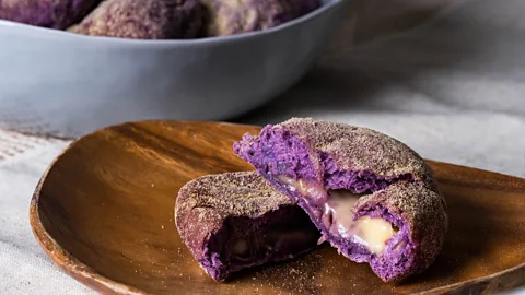 Richard Ernest Yap/Getty Images Ube also makes its way into ube cheese pandesal, a gourmet bread roll popular in the Philippines (Credit: Richard Ernest Yap/Getty Images)