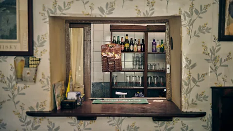 Hawlfraint y Goron / Crown copyright (2022 The Dyffryn Arms has no formal bar; instead, beer is served through a hatch in the wall (Credit: Hawlfraint y Goron / Crown copyright (2022) Cymru Wales)