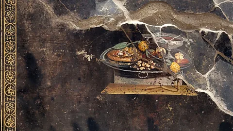 Abaca Press/Alamy A recently discovered fresco of a flatbread at Pompeii (Credit: Abaca Press/Alamy)
