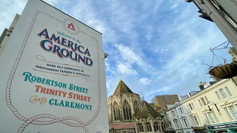 Debbie Ward A sign in front of a church and houses which reads "America Ground" (Credit: Debbie Ward)