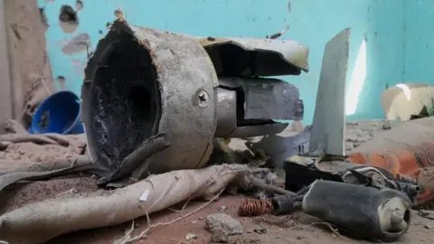 Reuters Remnants of a shell that targeted the refugee center, in el-Fasher, Sudan, October 7, 2025