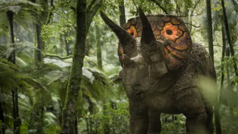 A Triceratops with colourful eye spots on its frill