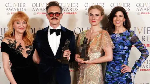 PA Media Sonia Friedman, Tom Fletcher, Jessica Swale and Eliza Lumley with their Cunard Best New Musical award for Paddington at The Olivier Awards at the Royal Albert Hall, London.