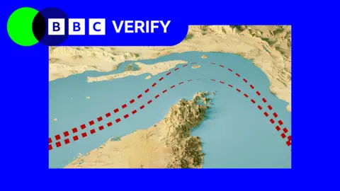 A satellite image of the Strait of Hormuz with two red lines to show shipping lanes.