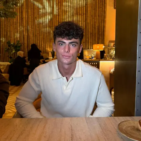 @tom.thebe Tom sitting at a table in a restaurant