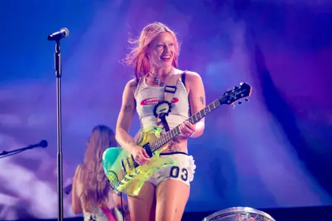 WireImage via Getty Images Rhian Teasdale of Wet Leg performs on the arena stage at Roskilde Festival 2025 on July 02, 2025 in Roskilde, Denmark. 