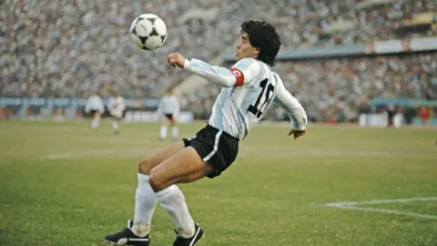 Getty Images Maradona mid-play during the 1986 world cup (1986 FIFA World Cup qualifying match against Peru at the National Stadium on June 23)