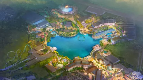 An artist's impression of the new Universal Studios theme park has a large body of water in the middle with various rides around the edge.